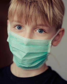 Surgical style face mask on a child - First-Res